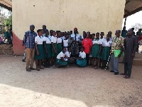 The chief in a group picture with students of Tuna Girls Model School