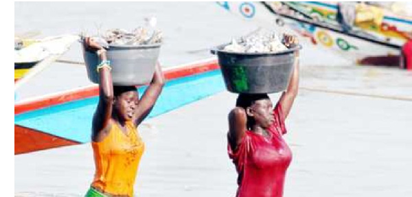 Women carry fish. In Ukara Island, Ukerewe District, women are constantly harassed and asked for sex