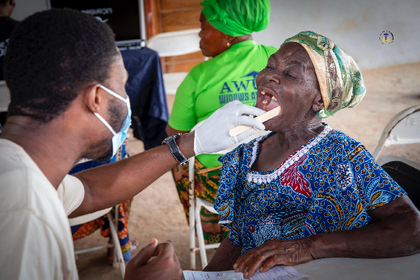 The outreach saw scores of residents taking turns to receive oral health screening