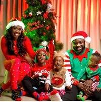 Claudia Lumor, publisher and CEO of Glitz Magazine with her family