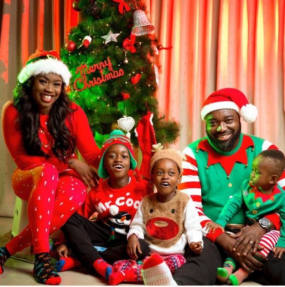 Claudia Lumor, publisher and CEO of Glitz Magazine with her family