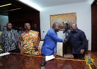 President Akufo-Addo with some members of the Adanwomase Kente Weavers and Sellers Association