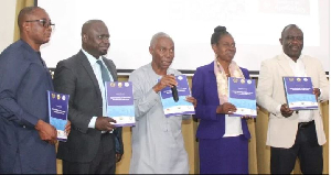 Prof. Awusabo-Asare, Prof. Annim, Dr Bediako, and other dignitaries launching the report