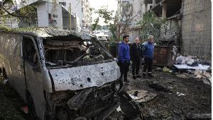 The wreckage of a vehicle at the site of an Israeli strike in Beirut’s southern suburbs