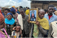 Hundreds of villagers attended a mass funeral for the victims of the landslide on Thursday