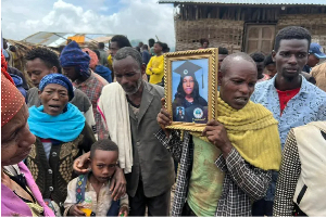 Hundreds of villagers attended a mass funeral for the victims of the landslide on Thursday