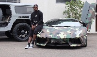 Sulley Muntari with one of his numerous cars