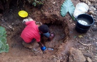 The Kwahu residents scooping water from the ground