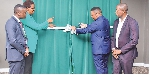 The Bank of Africa – Tanzania managing director Adam Mihayo (right) cuts a ribbon during the launch
