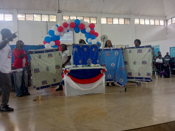 The centenary cloth, designed by an old student, was unveiled in two colous