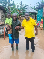 Abuakwa South NADMO director (R) with a resident