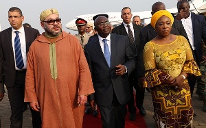 Veep Bawumia (middle) and Shirley Ayorkor Botchway escorting King Mohammed VI after arrival in Ghana
