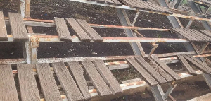 Weathered wooden benches at the stadium