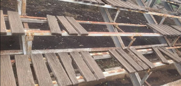 Weathered wooden benches at the stadium
