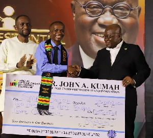 Nana Akufo-Addo with one of the beneficiaries of the Presidential Pitch