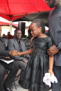Daughter of late Statcy Offei-Darko in a sorrowful mood