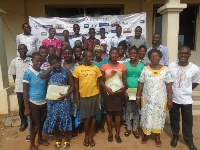 Some of the beneficiaries in a photograph with coordinators of the programme