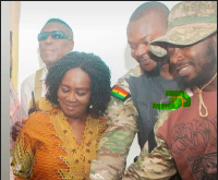 Naana Jane Opoku-Agyemang captured with Musah Attah, alias “Kromo