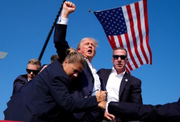 President Donald Trump with blood on his face after he survived 'assassination' attempt'