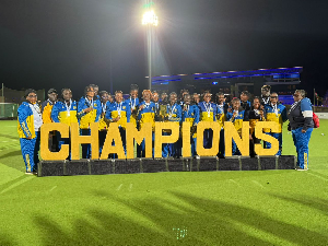 Players and officials of Royal Ladies with the trophy