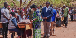 Malawian President Lazarus Chakwera waits to vote in the general election at Malembo village