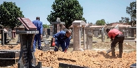 Workers at a cemetery in South Africa