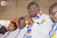 Former President John Agyekum Kufuor sipping from a box of Kalyppo at the 2016 NPP manifesto launch