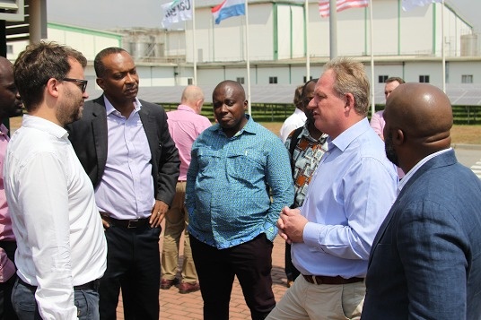 Mr. Kweku Awotwi (2nd left) in a discussion with guests after tour.