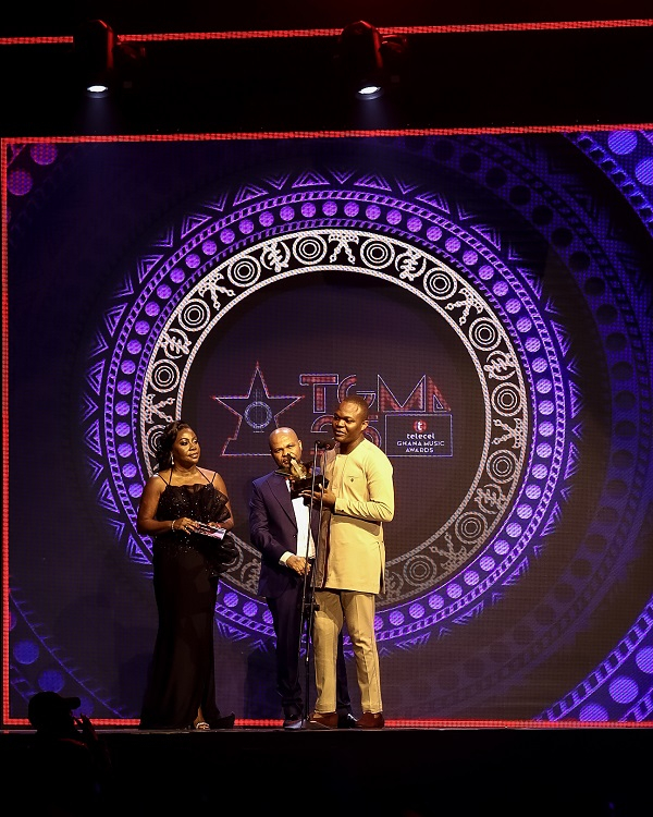 CEO of Telecel Ghana, Ing. Patricia Obo-Nai and David Umo present an award to Eugene Zuta