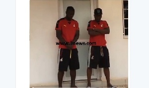 Asamoah Gyan and Jonathan Mensah playing the role of bouncer