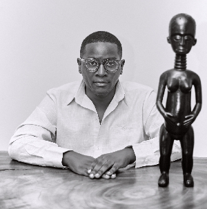 V. L.K. Djokoto pictured here with a figurine from his private collection