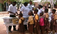 School pupils lined up to take food from Caterers