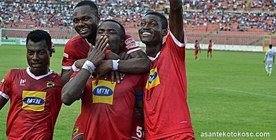 Captain Amos Frimpong of Kotoko been mobbed by his team mates