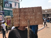 One of the demonstrators with a placard