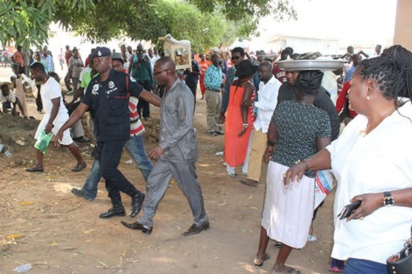 Peter Anarfi Mensah being led by the police