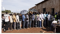 People queue to vote