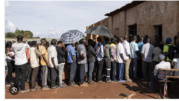 People queue to vote