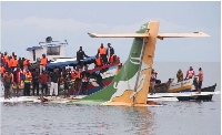 Rescuers attempt to recover the Precision Air passenger plane that crashed into Lake Victoria