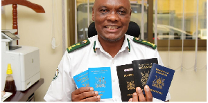 Mr Simon Mundeyi, the Internal Affairs spokesperson, displays Ugandan passports at the ministry’