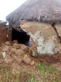 The collapsed building that killed the old woman and injured her grand children