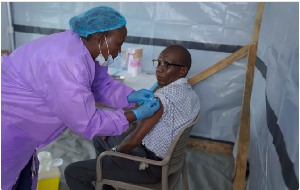 A health worker administers a dose of Ebola vaccine as part of the Tumaini trial in Ituri