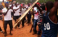 Hooded supporters of the ruling New Patriotic Party (NPP) in the Northern region brandishing sticks