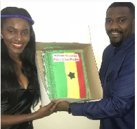 John Dumelo receiving a cake confirming his ambitions to become President of Ghana