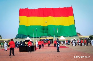 A giant Ghana flag draped over the Jubilee House office complex during the parade