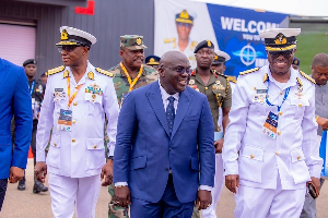 Julius Debrah (in blue suit) read the speech on behalf of President John Mahama