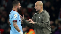 Kyle Walker in a conversation with Guardiola while at Manchester City