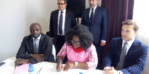 Minister for Fisheries & Aquaculture Development, Elizabeth Naa Afoley Quaye signing an MoU