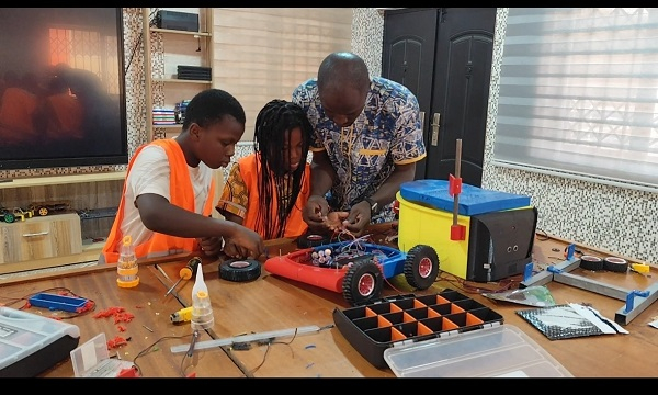 A teacher taking the pupils through a STEM lesson