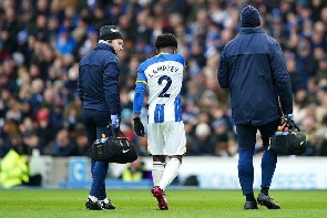Brighton's Tariq Lamptey being escorted from the pitch after suffering an injury
