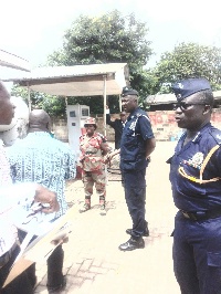 Officials from the Fire Service and police officers at CAD filling station